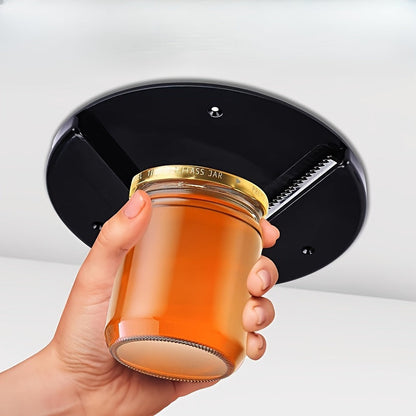 The Ergonomic Jar Opener is designed for elderly and arthritis patients, offering assistance in the kitchen. This Cabinet Mounted Bottle Opener is a durable plastic gadget that requires no power and is ideal for both home and office use.