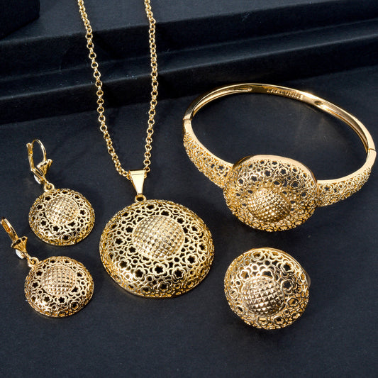 A collection of women's jewelry sets featuring intricately carved hollow patterns in copper. This set includes a round three-dimensional pendant necklace, bracelet, ring, and earrings, all designed in a Middle Eastern style with a retro floral motif.