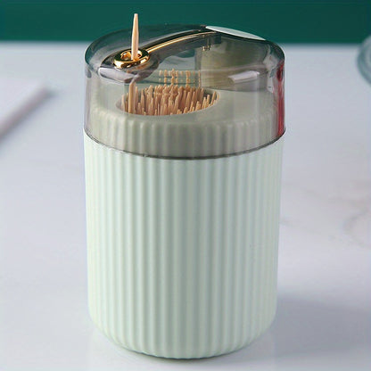 Automatic toothpick dispenser; no power needed. Press button for easy access on kitchen or dining table. Made of plastic.