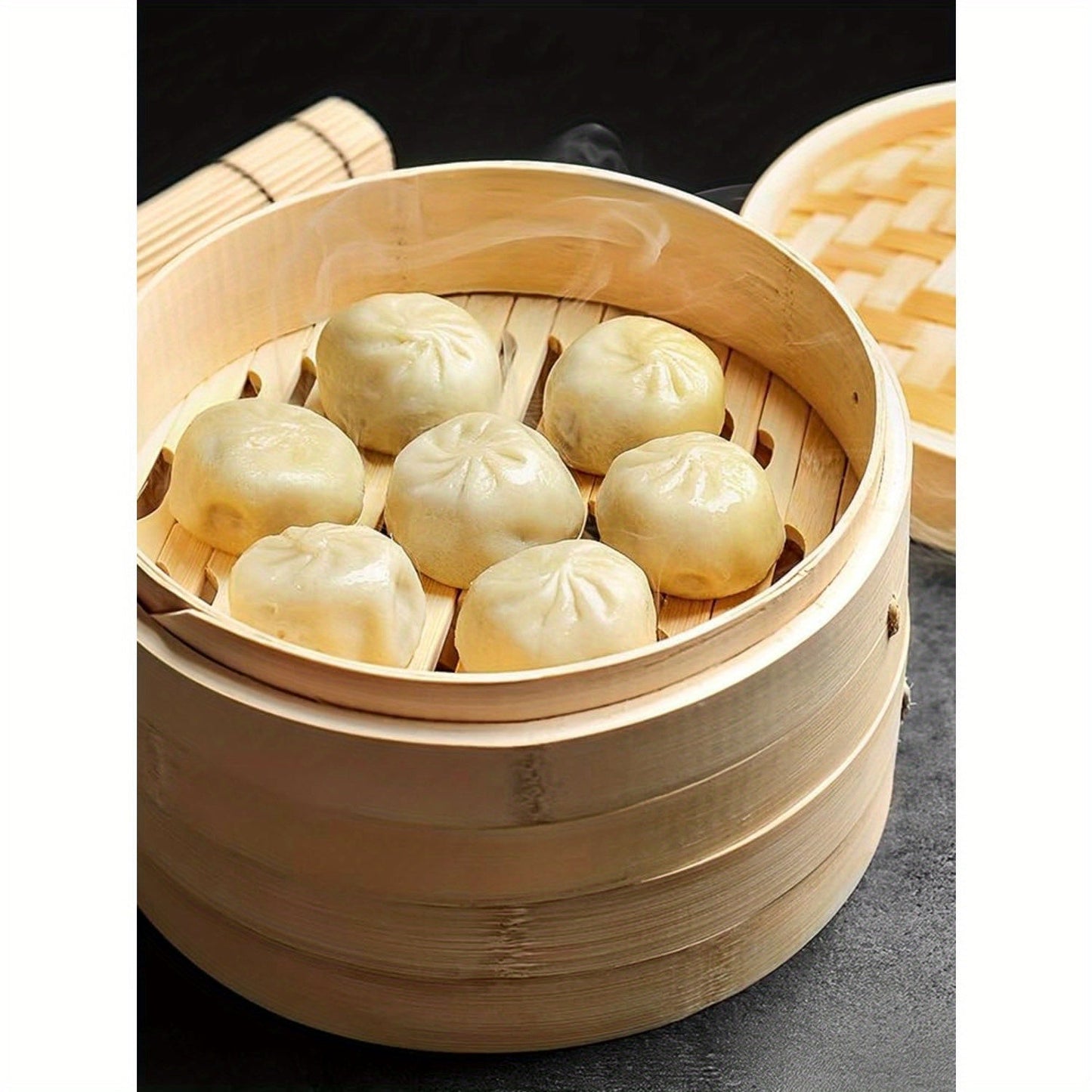 Handmade Bamboo Dumpling Steamer with a 25.4 cm Bamboo Steamer Basket, featuring 2 Cages and 1 Cover. This Lightweight Food Steamer is perfect for Steaming Dumplings, Vegetables, Fish, and Rice. Add a touch of decor to your kitchen with this Bamboo