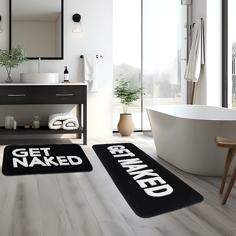 Soft and luxurious microfiber bath mat featuring anti-slip backing. Made of 100% polyester, this mat is machine washable and plush, with a playful "Get Naked" design. Perfect for use in the bathroom, bedroom, living room, kitchen, or at the entrance of