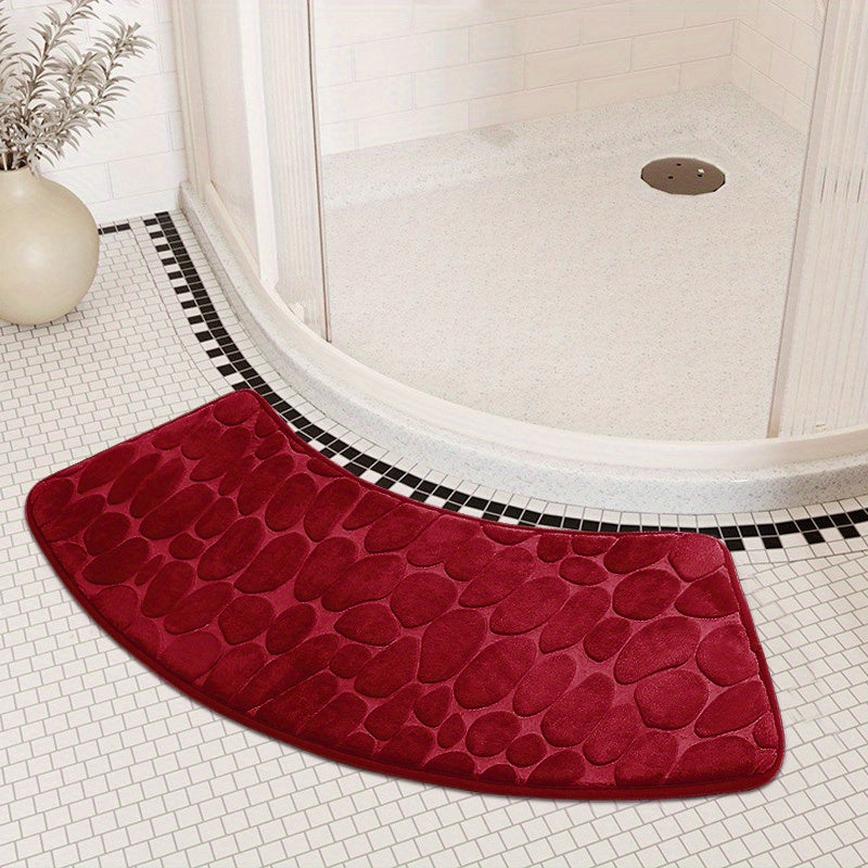 The Pebble Design Memory Foam Bath Mat is a stylish addition to your home, featuring a curved shape for added comfort. This non-slip mat is highly absorbent and can be easily machine washed. Made of thick three-layer flannel, it is perfect for use in the