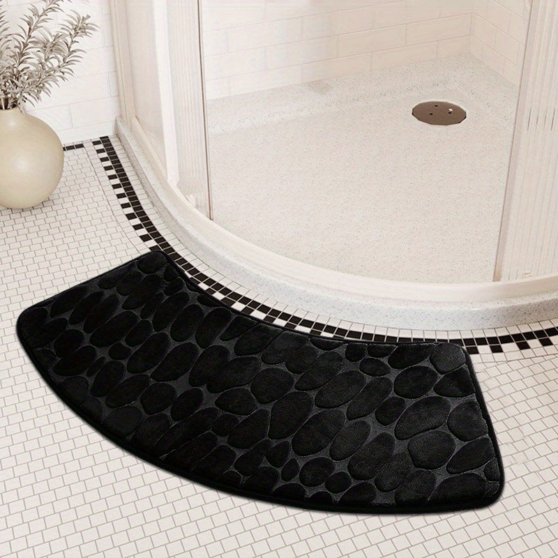 The Pebble Design Memory Foam Bath Mat is a stylish addition to your home, featuring a curved shape for added comfort. This non-slip mat is highly absorbent and can be easily machine washed. Made of thick three-layer flannel, it is perfect for use in the