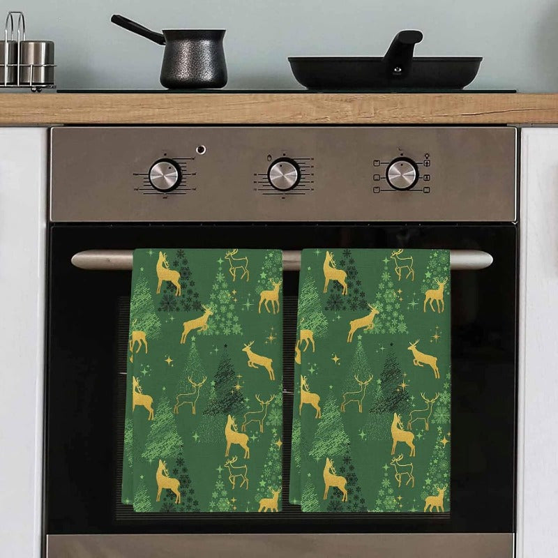 Set of 2 deer silhouette green star tree Christmas kitchen towels, featuring dimensions of 45.72 x 66.04cm. This set includes a bar towel and tea towel, all made of super soft material that is quick-drying and perfect for use as a hand towel or dish