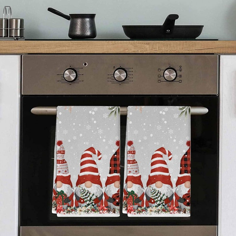 A festive Merry Christmas themed kitchen towel set featuring 2 pieces in dimensions of 45.72*66.04cm. The design includes dwarfs, Christmas trees, and poinsettia balls in gray. The set includes a soft and durable kitchen dish towel and hand towel.