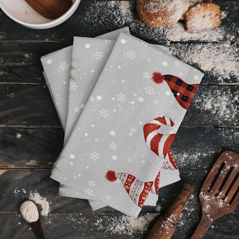 A festive Merry Christmas themed kitchen towel set featuring 2 pieces in dimensions of 45.72*66.04cm. The design includes dwarfs, Christmas trees, and poinsettia balls in gray. The set includes a soft and durable kitchen dish towel and hand towel.