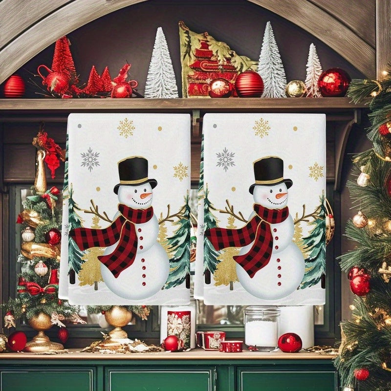 Set of 2 Christmas-themed kitchen towels featuring a snowman, Christmas tree, and golden snowflakes. These towels are highly absorbent, extremely soft, and fast-drying, perfect for use as dish towels, bar towels, or tea towels. Each towel measures