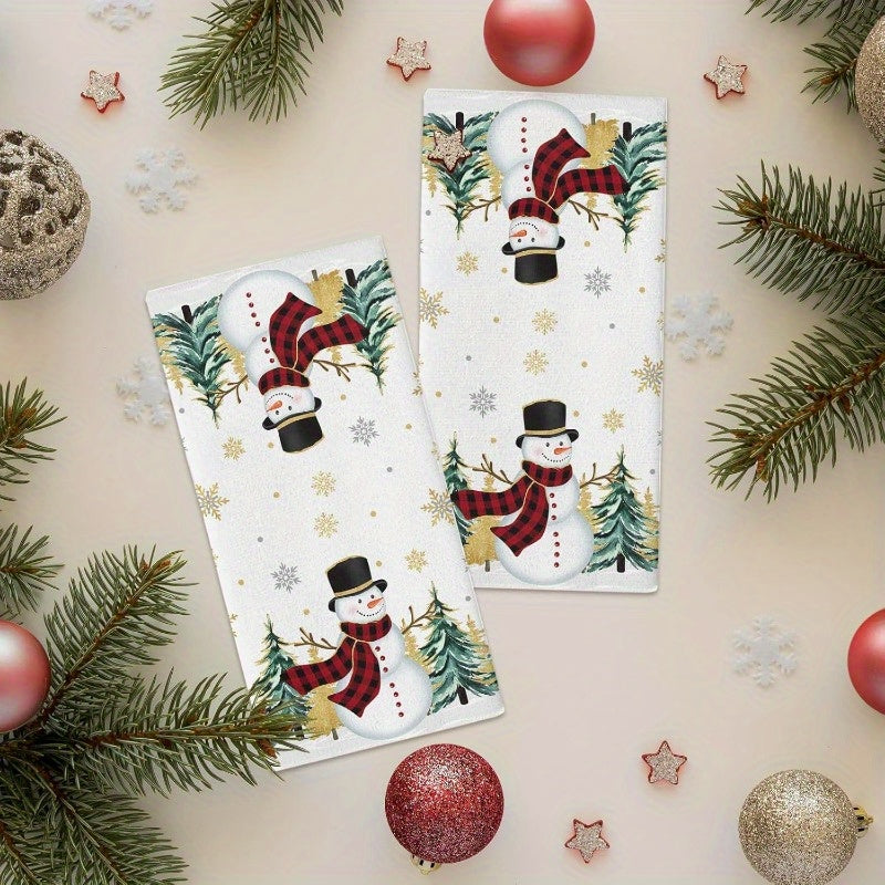 Set of 2 Christmas-themed kitchen towels featuring a snowman, Christmas tree, and golden snowflakes. These towels are highly absorbent, extremely soft, and fast-drying, perfect for use as dish towels, bar towels, or tea towels. Each towel measures