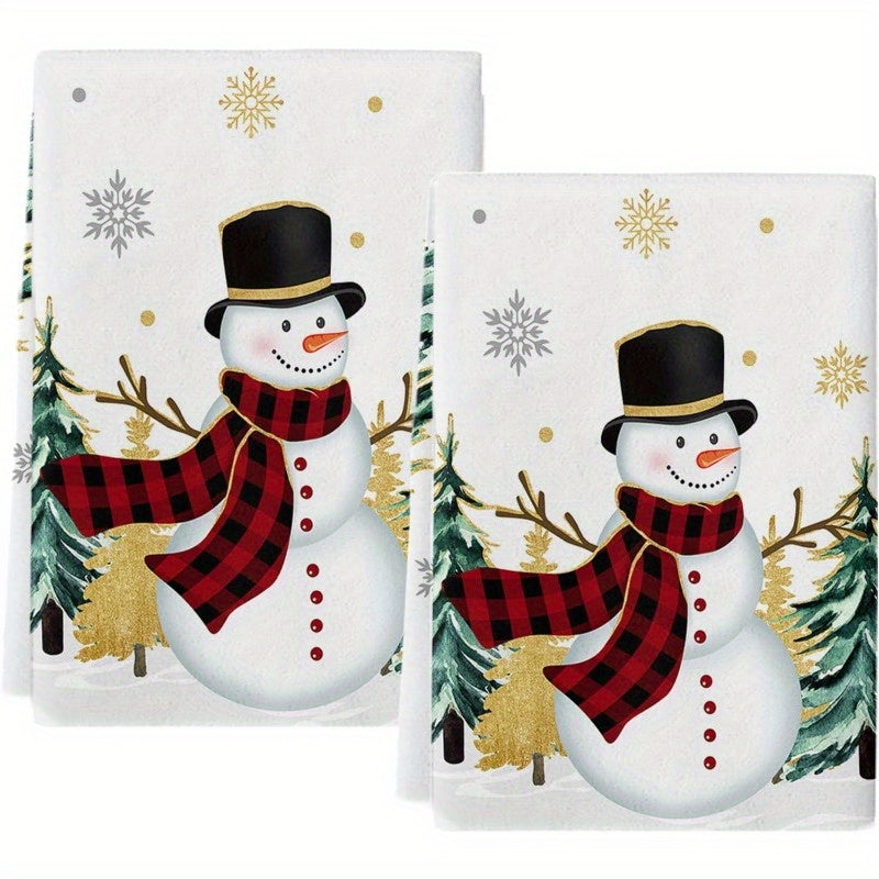 Set of 2 Christmas-themed kitchen towels featuring a snowman, Christmas tree, and golden snowflakes. These towels are highly absorbent, extremely soft, and fast-drying, perfect for use as dish towels, bar towels, or tea towels. Each towel measures