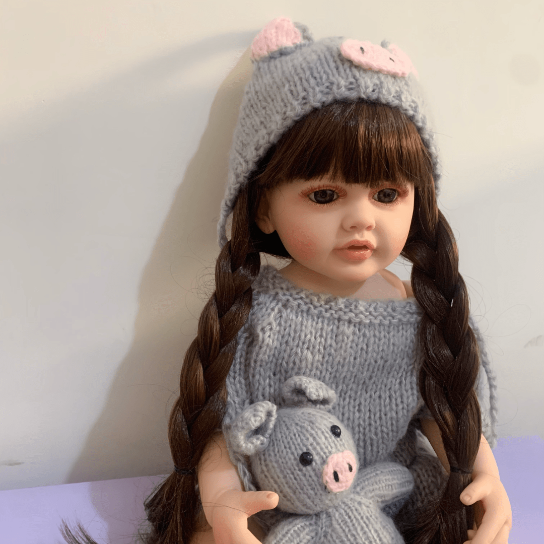 22 inch full vinyl body reborn girl doll with long hair, realistic princess design, and plush toy.