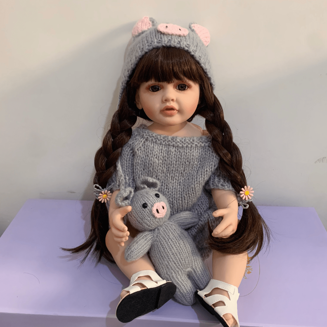 22 inch full vinyl body reborn girl doll with long hair, realistic princess design, and plush toy.