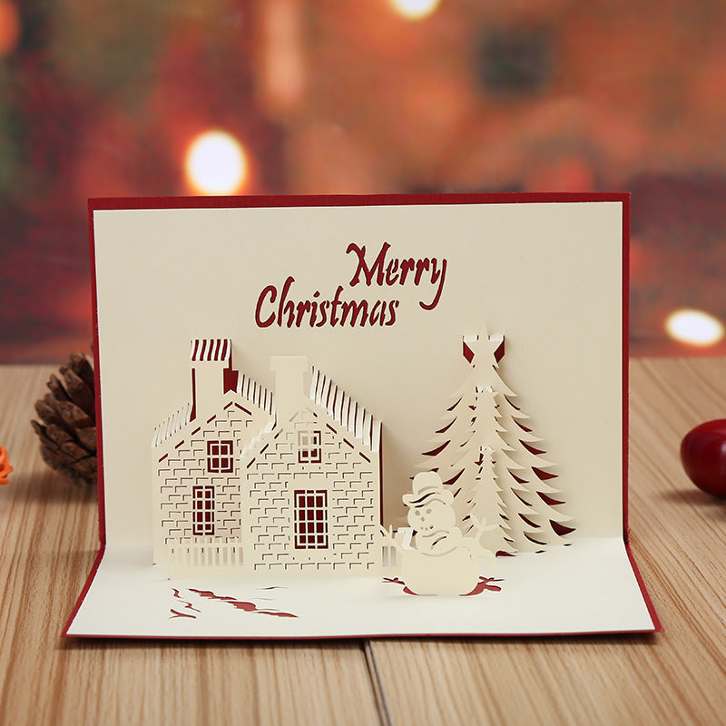 Get into the holiday spirit with this 3D Pop-Up Christmas Card featuring a festive castle and tree design. Made of hollow-out plastic, this unique greeting card is the perfect decoration for the holiday season and New Year's celebration.