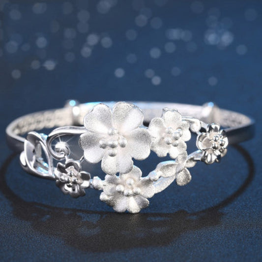 Sterling Silver Flower Bracelet made from S999 silver, features an adjustable design that is both fashionable and versatile. This noble fashion bracelet is a perfect gift for lovers, mothers, daughters, and as party, Valentine's Day, or Christmas gifts.