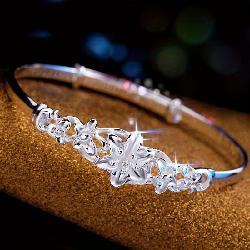 Sterling Silver Flower Bracelet made from S999 silver, features an adjustable design that is both fashionable and versatile. This noble fashion bracelet is a perfect gift for lovers, mothers, daughters, and as party, Valentine's Day, or Christmas gifts.