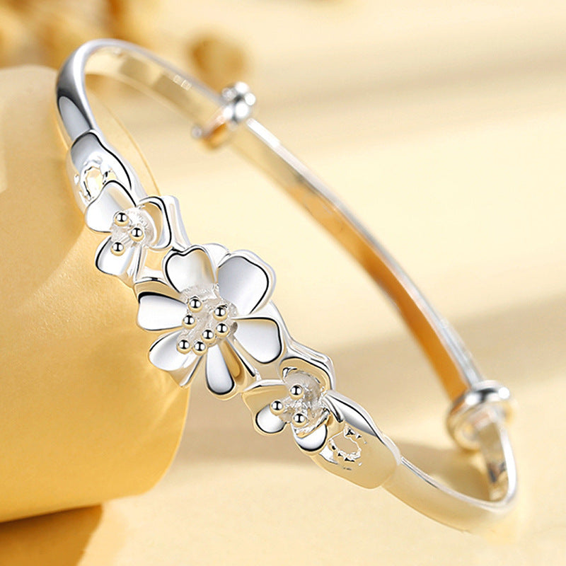 Sterling Silver Flower Bracelet made from S999 silver, features an adjustable design that is both fashionable and versatile. This noble fashion bracelet is a perfect gift for lovers, mothers, daughters, and as party, Valentine's Day, or Christmas gifts.