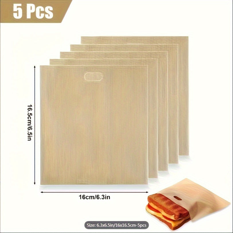 A set of five Glass Fiber Non-Stick Reusable Toaster Bags in a 6.3x6.5 inch/16x16.5 cm size, perfect for making Grilled Cheese Sandwiches, Pizza, Panini, Garlic Bread, and more. These bags are compatible with microwaves and grills, making them versatile