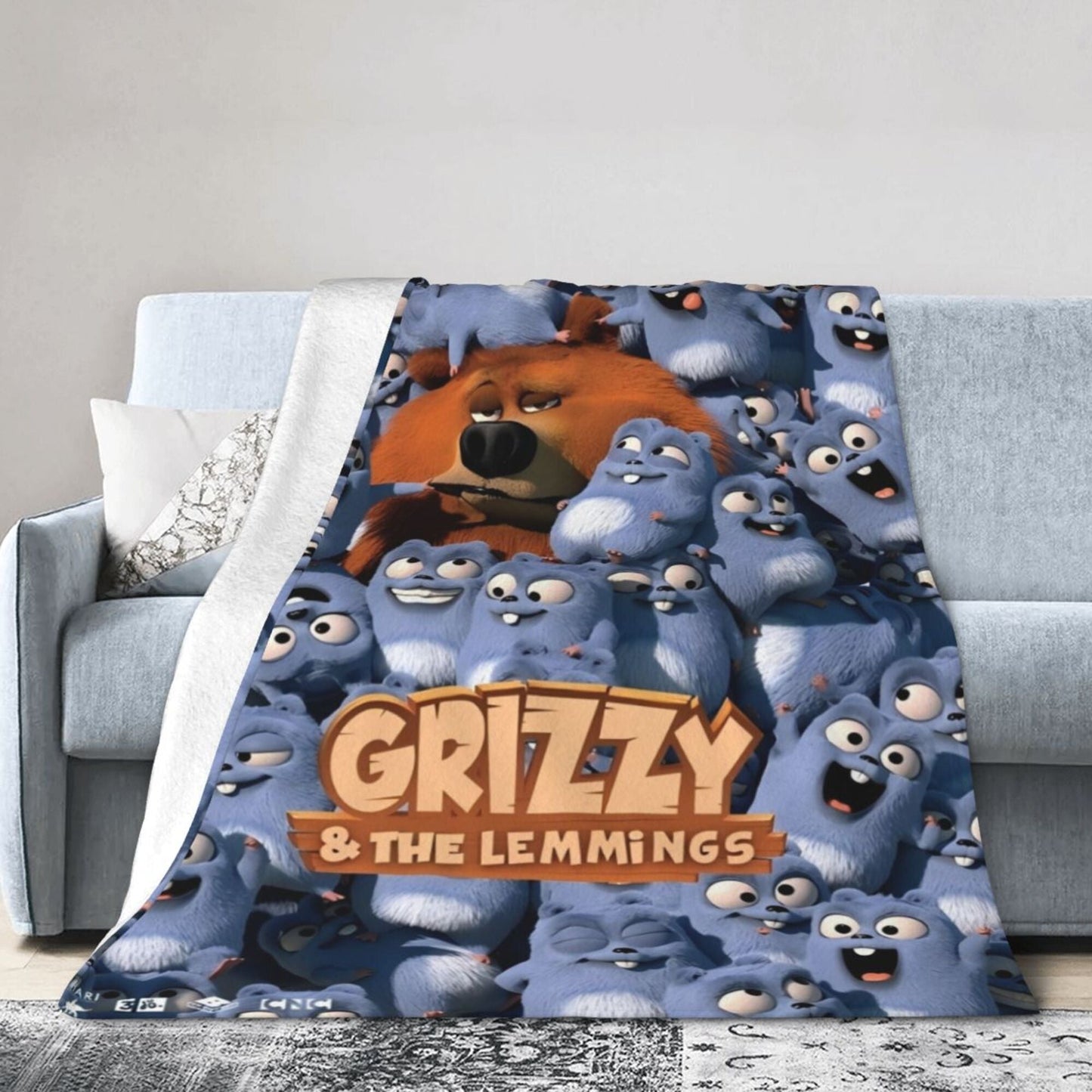 Flannel throw blanket featuring Grizzly & Lemmings anime print made of 100% polyester. This all-season blanket is soft, comfortable, and lightweight, suitable for use on the sofa, office, bed, or during travel. Perfect for gifting, it showcases a