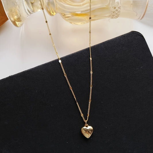 Vintage-inspired golden heart pendant necklace for women, perfect for everyday wear or gifting. Made of alloy material.