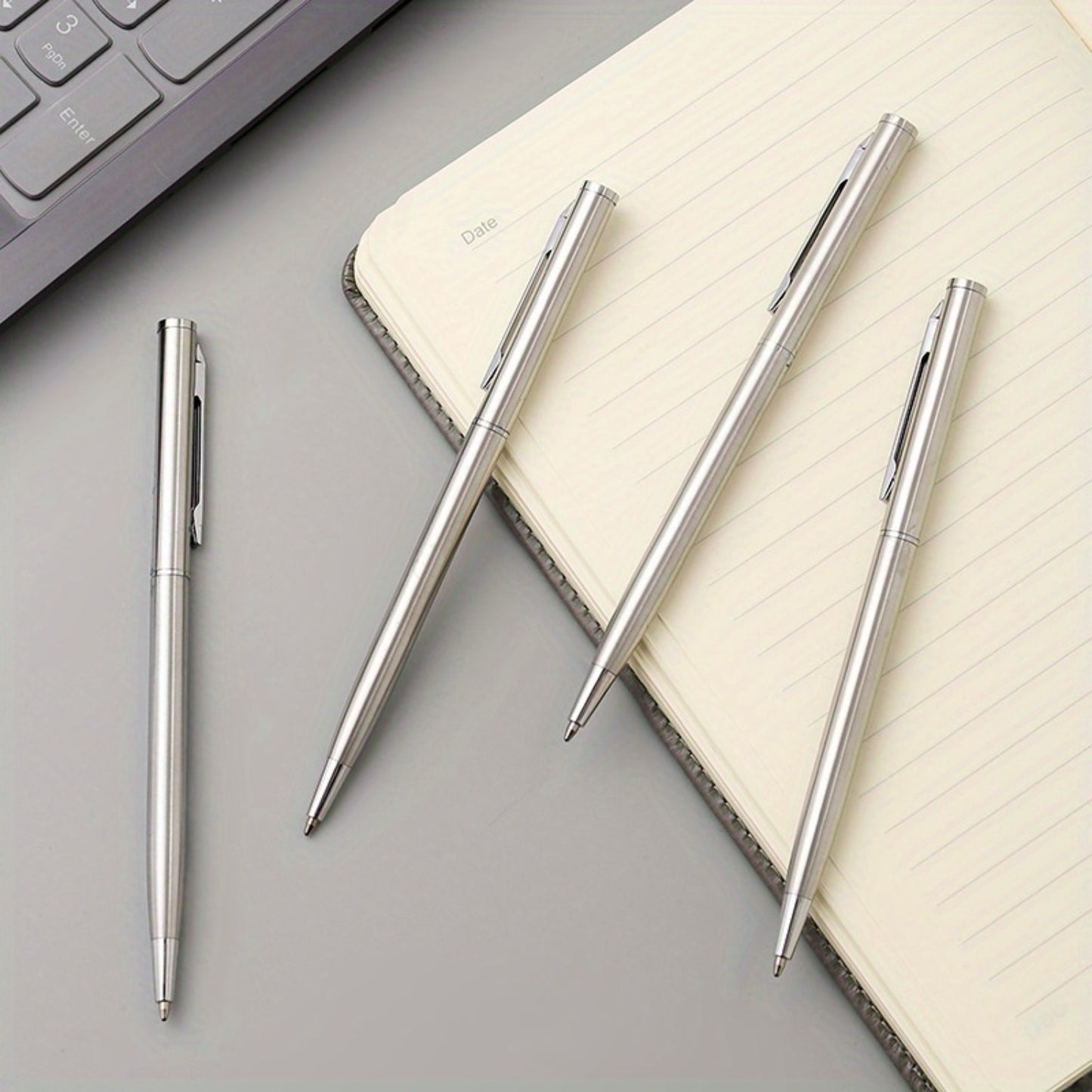 5 sleek silvery stainless steel ballpoint pens with medium point and twist action - ideal for business and office use, school supplies.