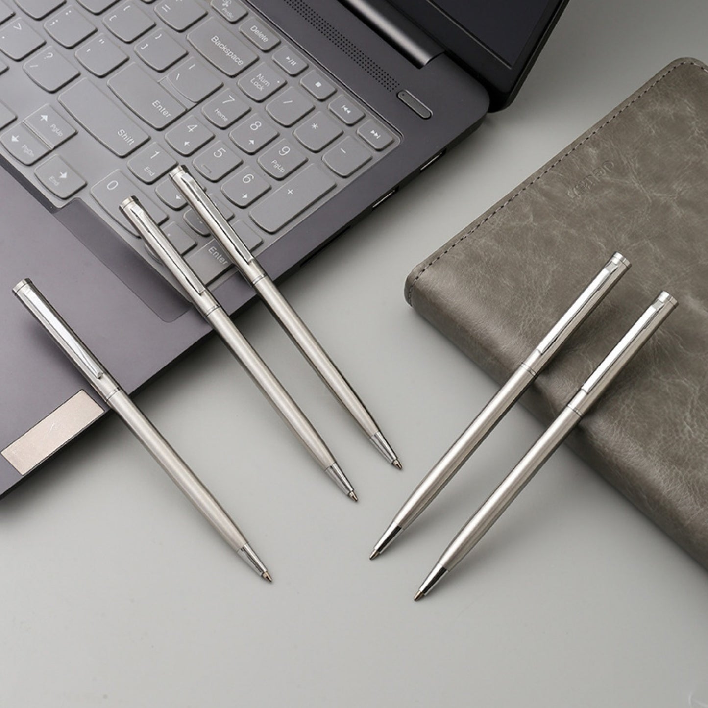 5 sleek silvery stainless steel ballpoint pens with medium point and twist action - ideal for business and office use, school supplies.