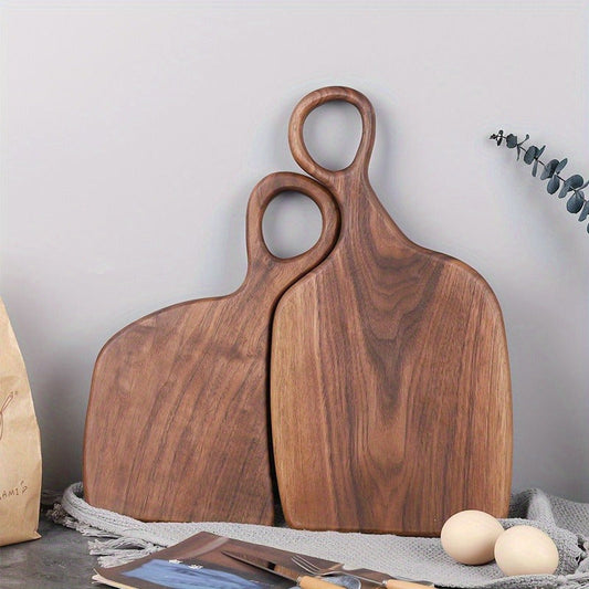 Two handmade walnut chopping boards, perfect for food preparation in the kitchen. Made from high-quality, eco-friendly, food-safe log materials. Ideal for couples and home cooks.