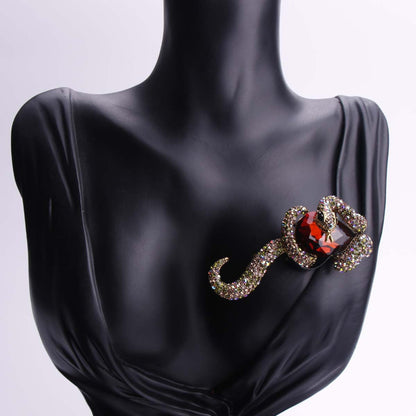 Luxurious punk style enamel snake brooch featuring stunning inlaid zirconia, perfect for both men and women. This unique animal pin adds a touch of irregular shape fashion to any party or banquet outfit. Ideal accessory for a stylish suit or coat.