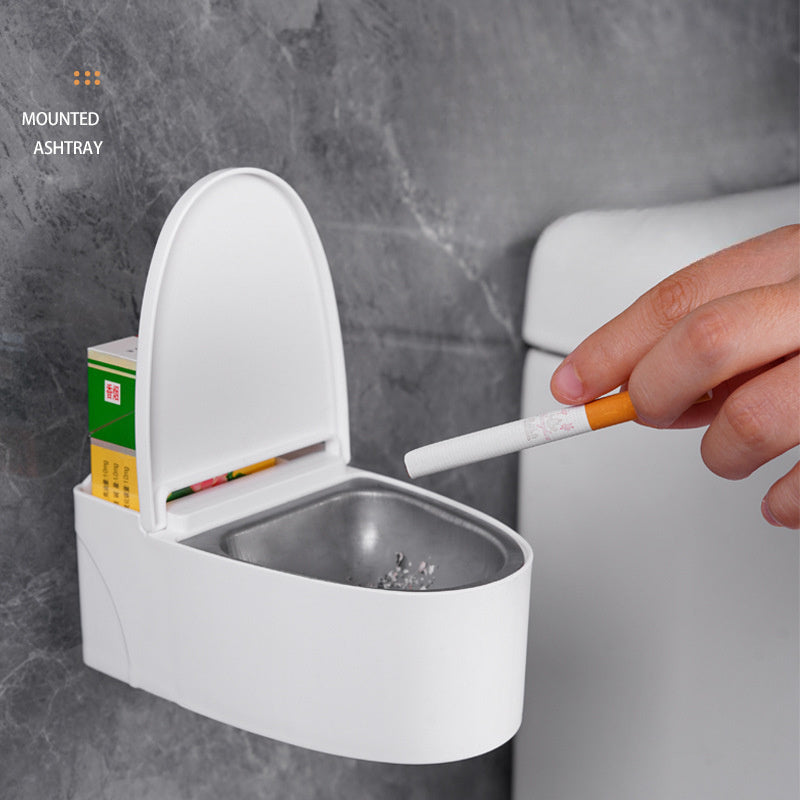 Wall-Mounted toilet ashtray with lid, plastic material, easy to clean, prevents flying ashes, ideal bathroom accessory for home.