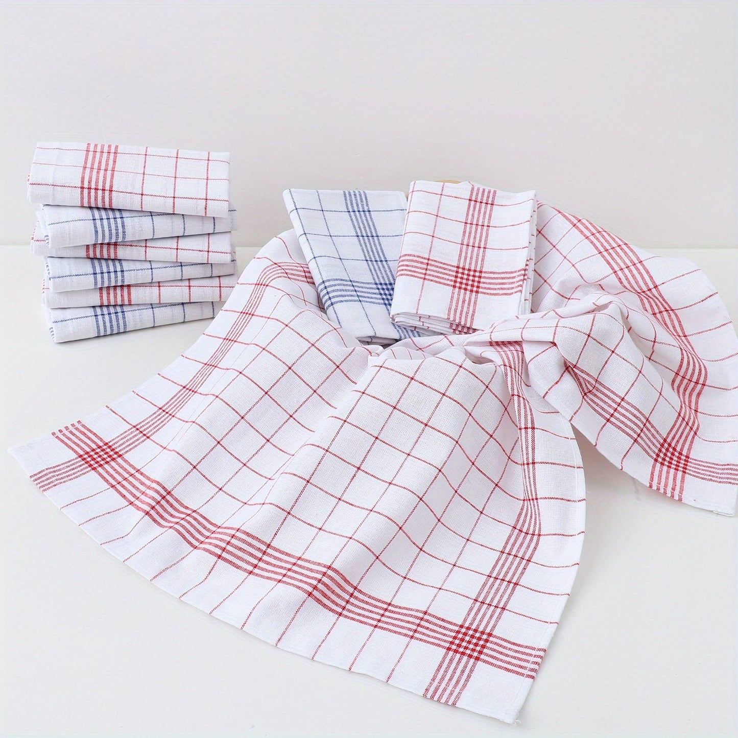 Pack of 12 kitchen towels in 2 colors (blue and red plaid), made of cotton knit with stripes and checkers. These multipurpose cloths are suitable for use in the home, living room, bedroom, outdoor, bathroom, and kitchen. They are reusable cleaning cloths