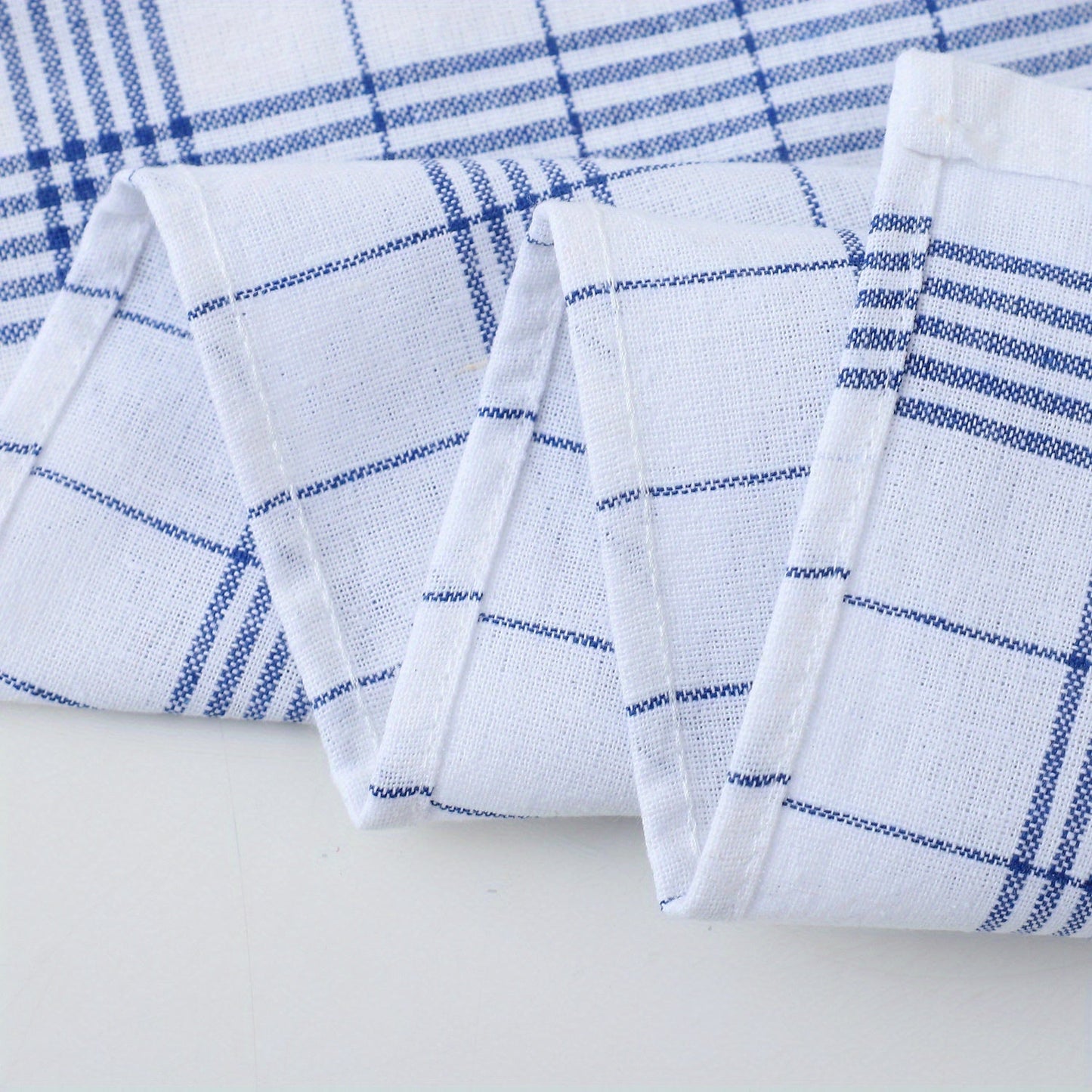 Pack of 12 kitchen towels in 2 colors (blue and red plaid), made of cotton knit with stripes and checkers. These multipurpose cloths are suitable for use in the home, living room, bedroom, outdoor, bathroom, and kitchen. They are reusable cleaning cloths