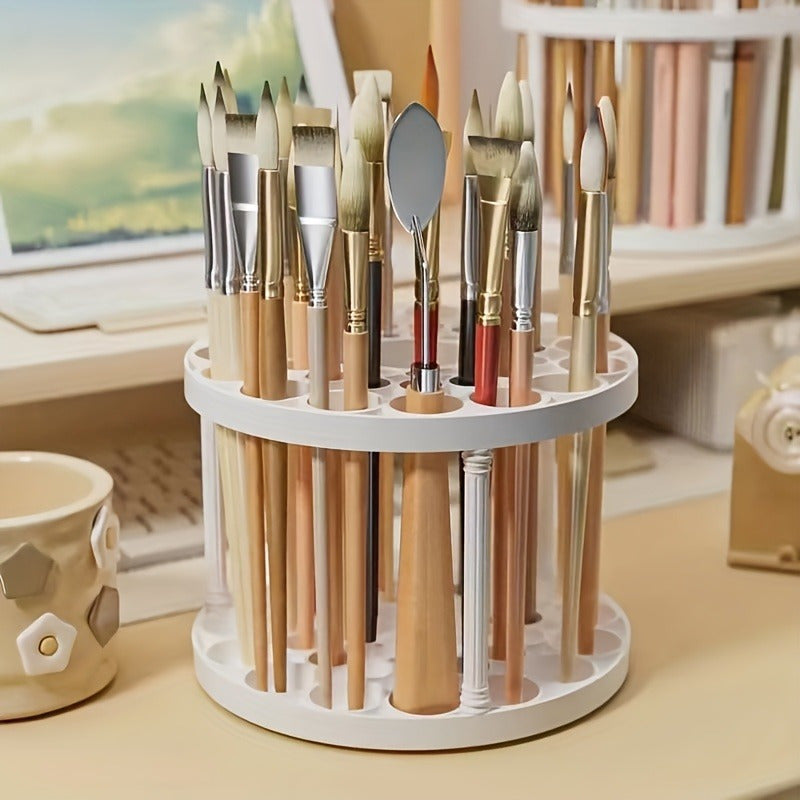 Rotating paint brush organizer with varnish finish, detachable for art brushes, pens, and makeup tools. Compact white desk accessory.