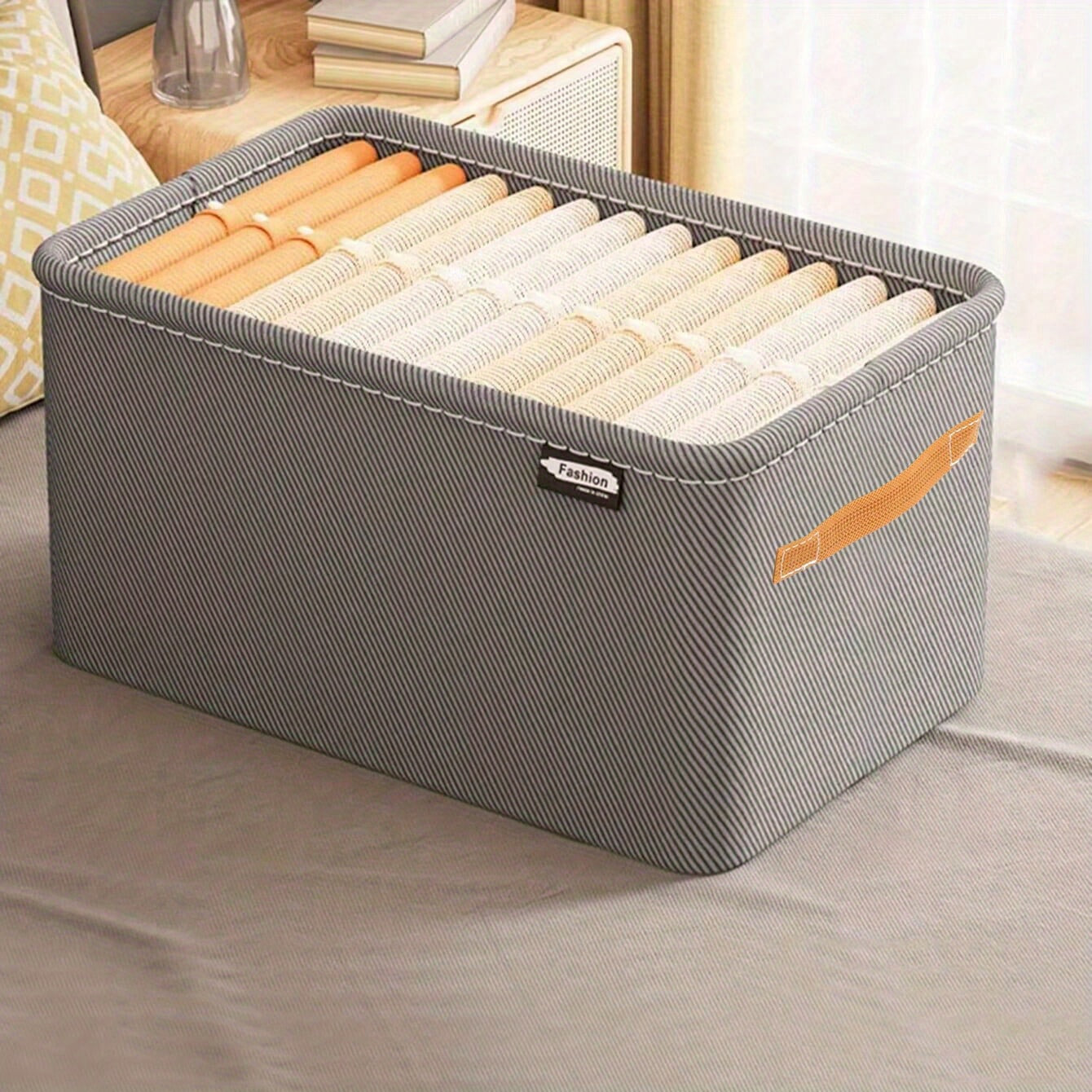 Sturdy and durable steel rimmed storage box, does not have a lid. Can be stacked in wardrobe for easy organization of clothes, with handles for convenient carrying.