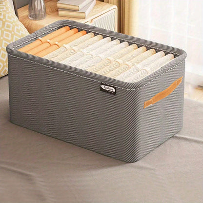 Sturdy and durable steel rimmed storage box, does not have a lid. Can be stacked in wardrobe for easy organization of clothes, with handles for convenient carrying.