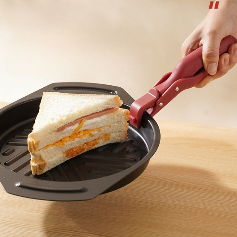 Two pieces of heat-resistant silicone potato clips that are designed to securely grip dishes without slipping. These kitchen utensils are ideal for handling hot food, as well as lifting plastic bowls and pans with ease.