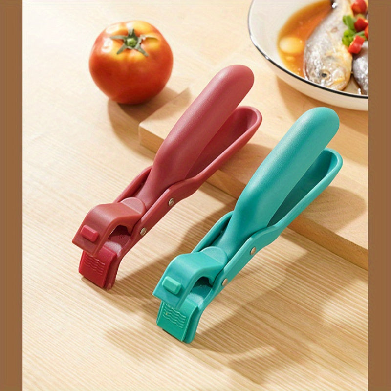 Two pieces of heat-resistant silicone potato clips that are designed to securely grip dishes without slipping. These kitchen utensils are ideal for handling hot food, as well as lifting plastic bowls and pans with ease.