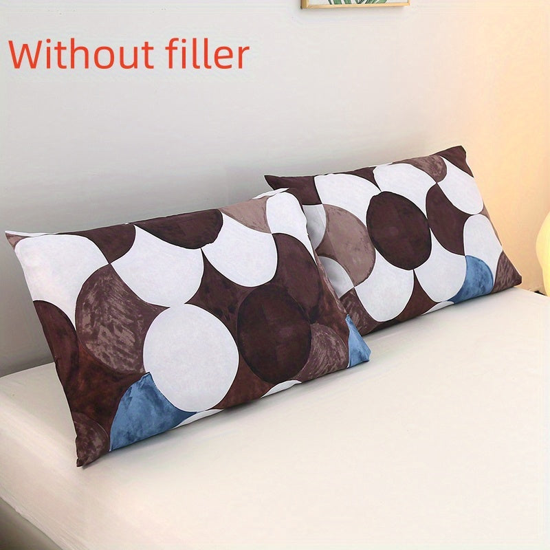 Two luxurious brushed pillowcases featuring soft and skin-friendly material with floral and geometric designs. They have an envelope closure and are machine washable. Inserts are not included.