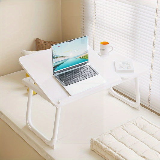 Folding laptop desk with adjustable height settings, in white/black, suitable for home, dorm, or office use. Ideal for studying or working in bed.