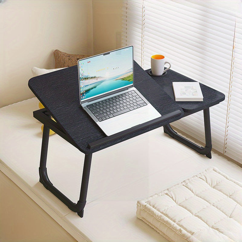 Folding laptop desk with adjustable height settings, in white/black, suitable for home, dorm, or office use. Ideal for studying or working in bed.