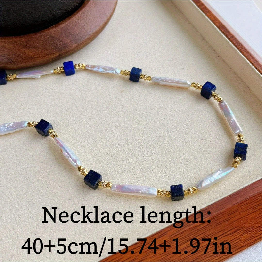 A sophisticated necklace with a vintage charm, featuring Baroque pearls and Lapis Lazuli stones in a Bohemian style. Made with natural freshwater pearls showcasing unique growth flaws, this piece is a stunning addition to any women's fashion collection.