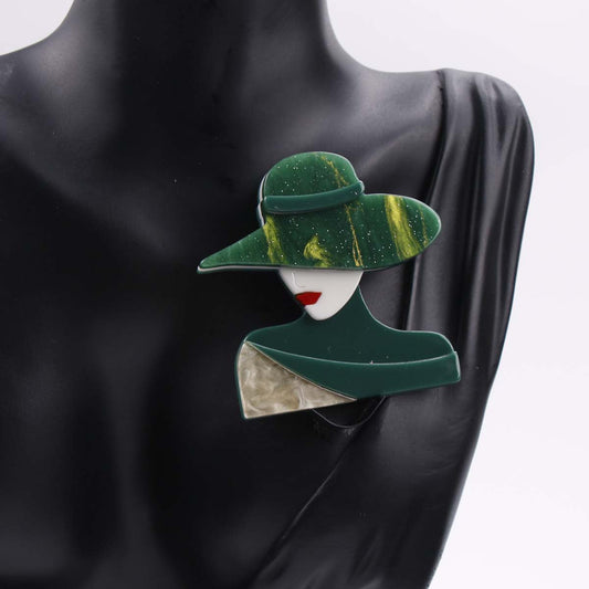 Vintage and minimalist cartoon character pin in stylish hat design made of chic acrylic, adorned with novelty rhinestone and enamel. Perfect lapel accessory for clothing.