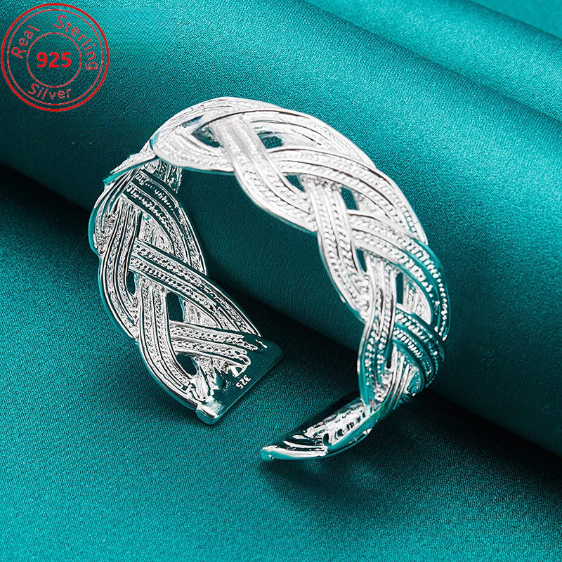 This bracelet is made of 925 sterling silver and features a woven design that is both stylish and elegant. It is adjustable and perfect for everyday wear, parties, birthdays, and Thanksgiving. This trendy piece of jewelry is a perfect gift for any female