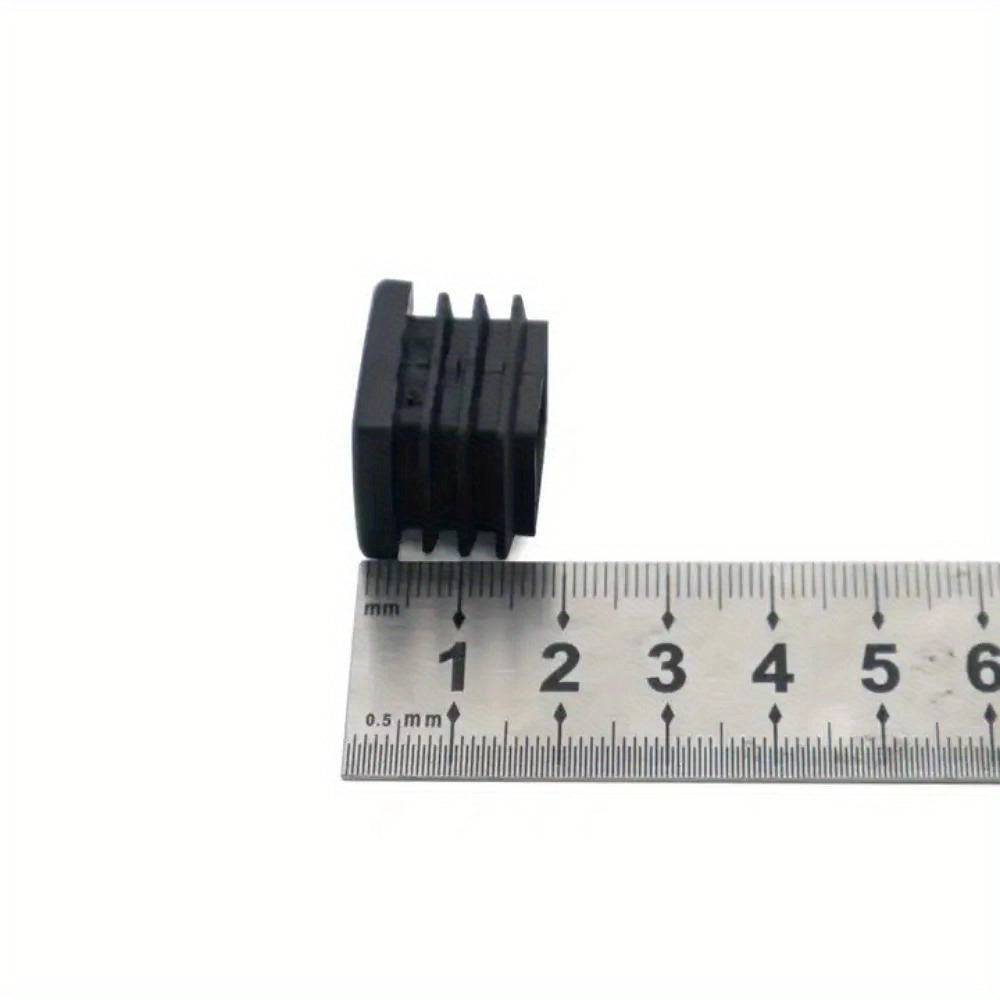 Protective black plastic caps designed specifically for 19mm square table feet to safeguard metal tubing and furniture legs from potential damage.