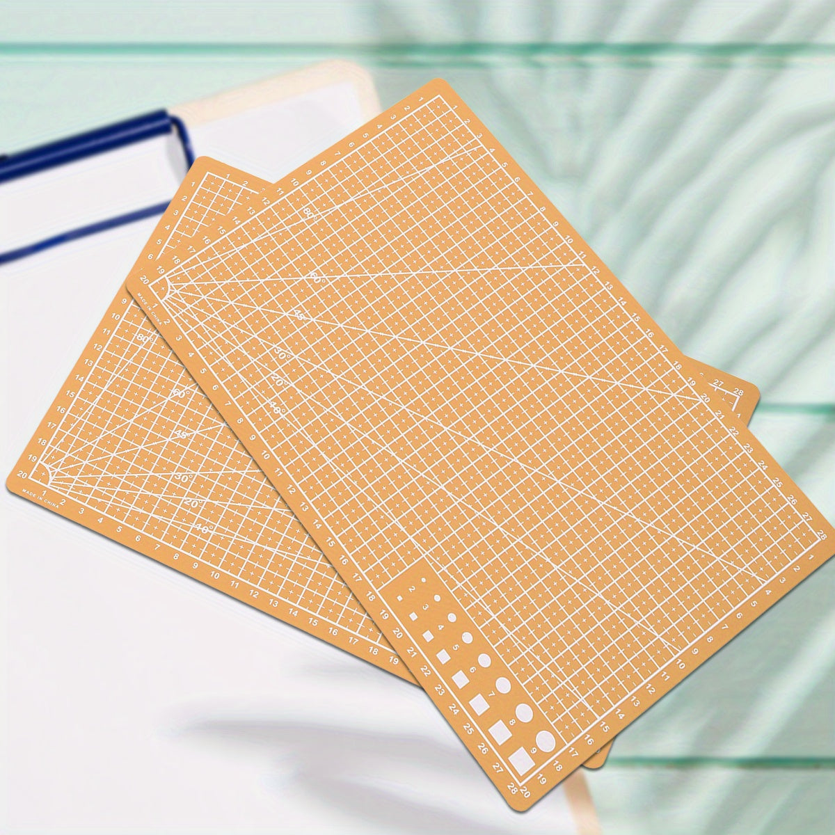 Durable PP material rotary cutting mat for precision sewing and scrapbooking, ideal for crafters and DIY enthusiasts, protects surfaces and ensures precise cuts.