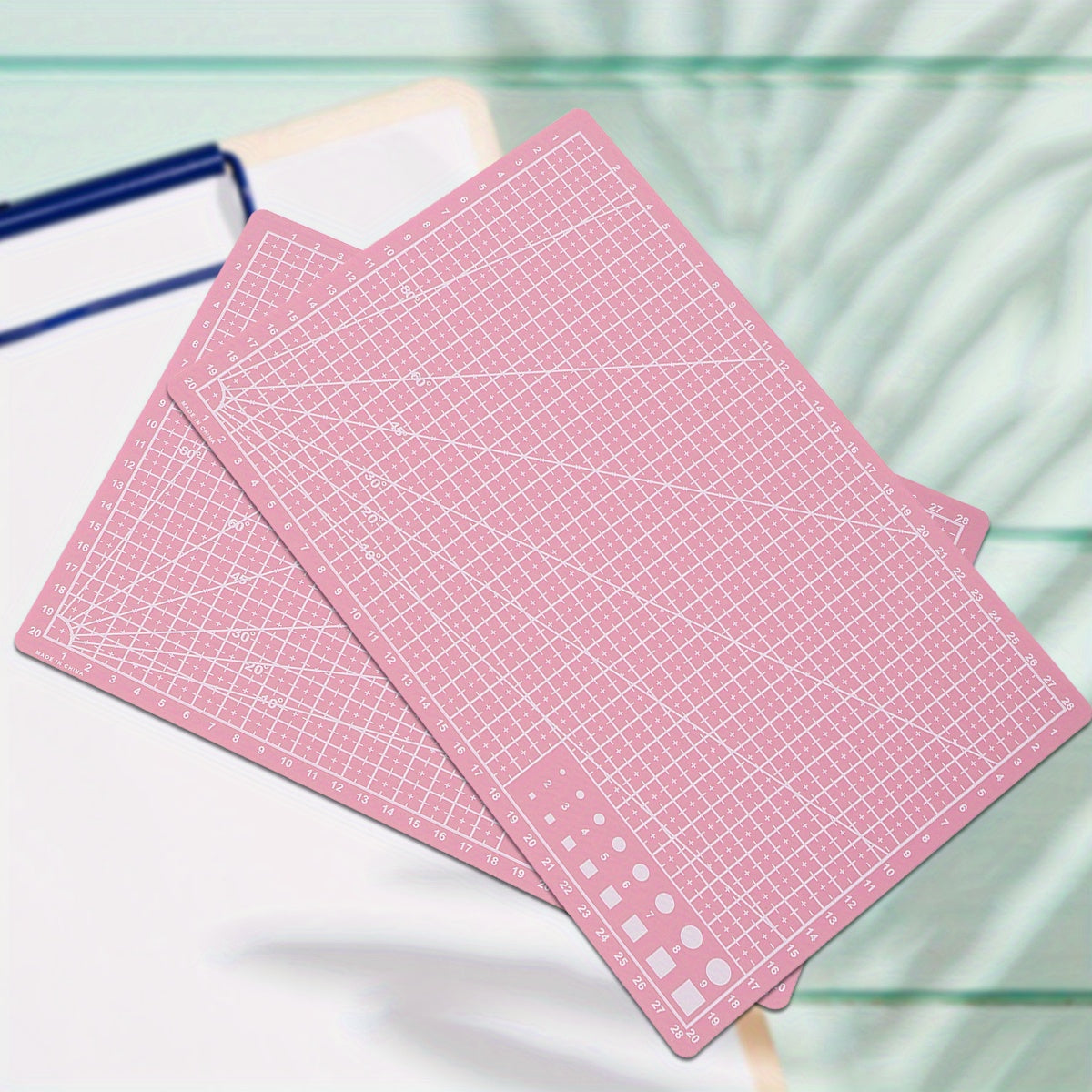 Durable PP material rotary cutting mat for precision sewing and scrapbooking, ideal for crafters and DIY enthusiasts, protects surfaces and ensures precise cuts.