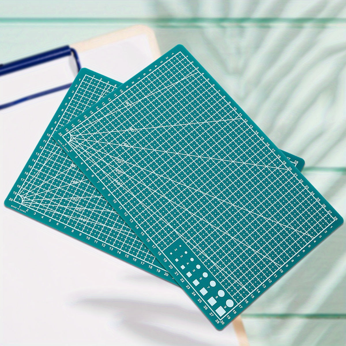 Durable PP material rotary cutting mat for precision sewing and scrapbooking, ideal for crafters and DIY enthusiasts, protects surfaces and ensures precise cuts.