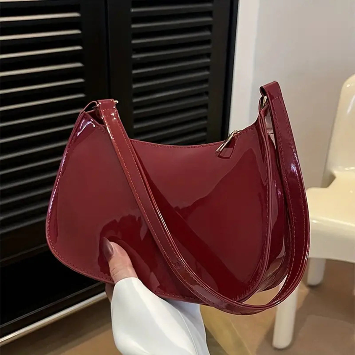 Vintage handbag for women, chic shoulder design, glossy material, sold individually.