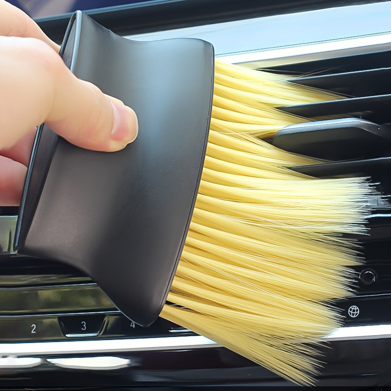 Soft yellow and hard black bristle dual-head car interior brush for easy cleaning of air conditioning, dashboard, and buttons without needing power. Perfect auto cleaning tool.