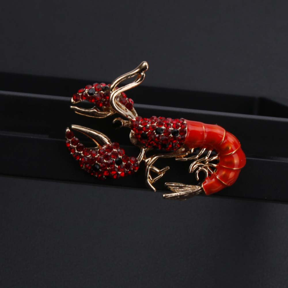 Elegant antique lobster brooch adorned with shimmering rhinestones and finished with enamel - Ideal for adding a touch of luxury to men's suits and accessories.