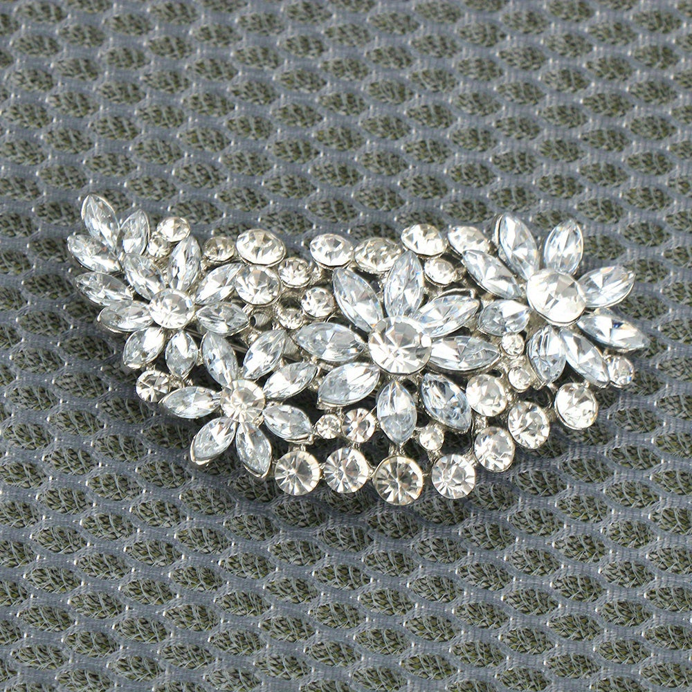 Luxurious enamel water crystal brooch inspired by vintage designs, featuring an irregular shiny pattern. This women's fashion accessory is perfect for adding a touch of elegance to banquet dresses, novelty clothing, and jewelry collections. Stand out