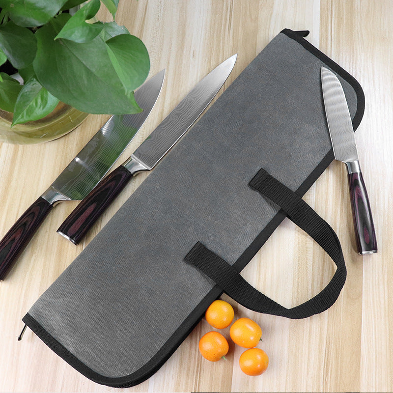 Fashionable water-resistant waxed canvas chef's knife roll bag made of durable polyester fiber. This portable kitchen utensil storage case features a handle for easy carrying of culinary tools.