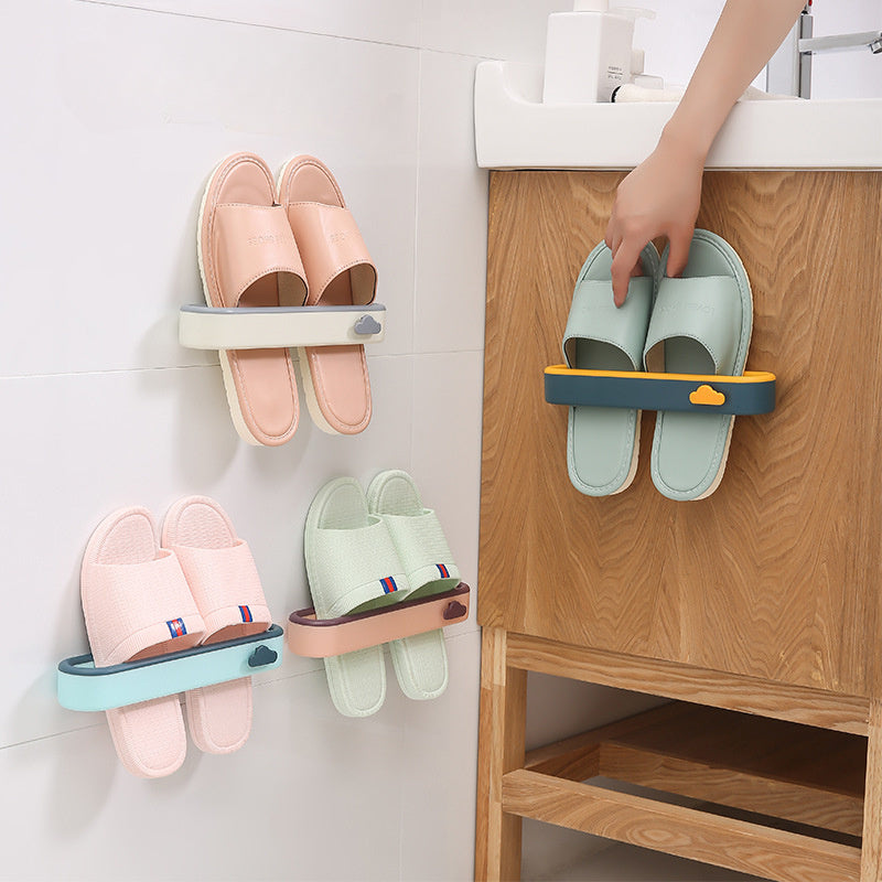 Wall-mounted shoe rack inspired by clouds, no drilling needed. Made of space-saving plastic for storing slippers in the bathroom.